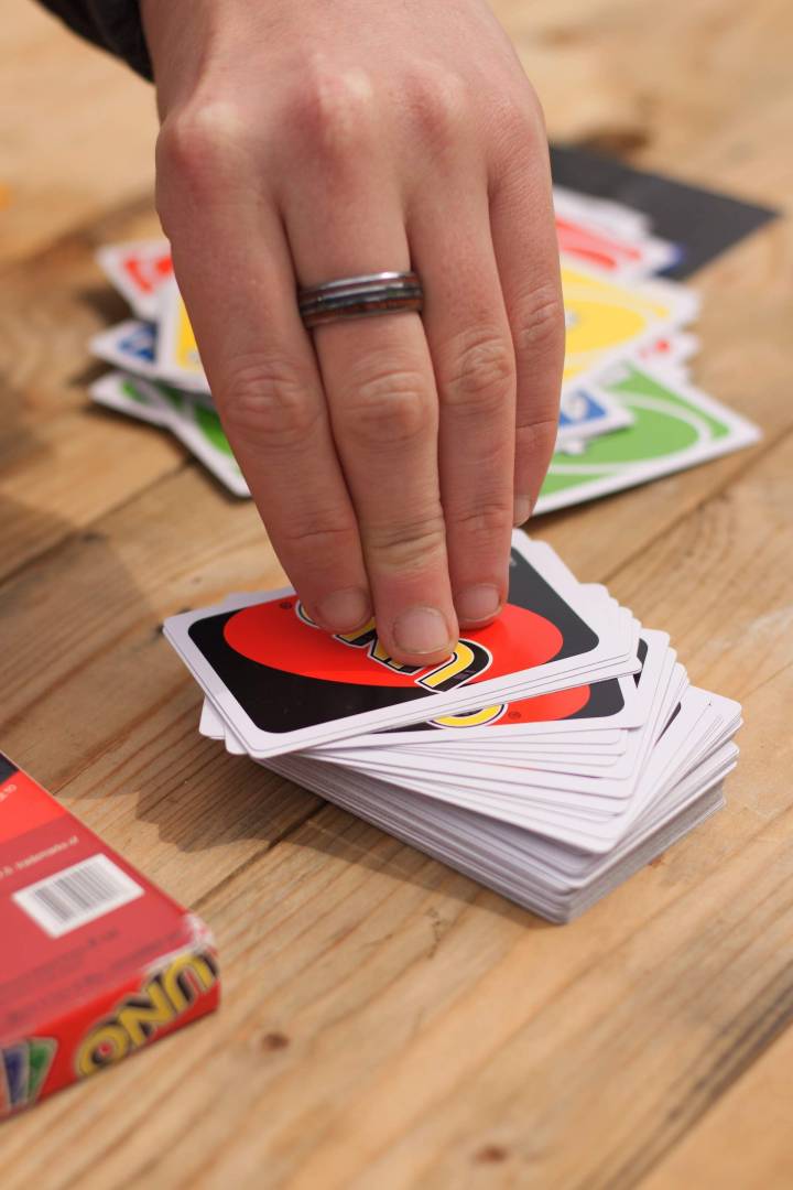Hand Playing Uno Card Game